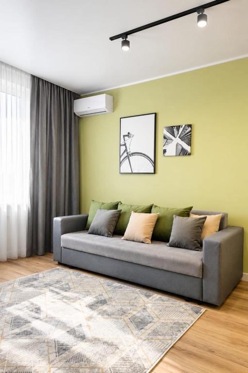 a living room with a couch in a room at ЖК "Женис III" in Kokshetau