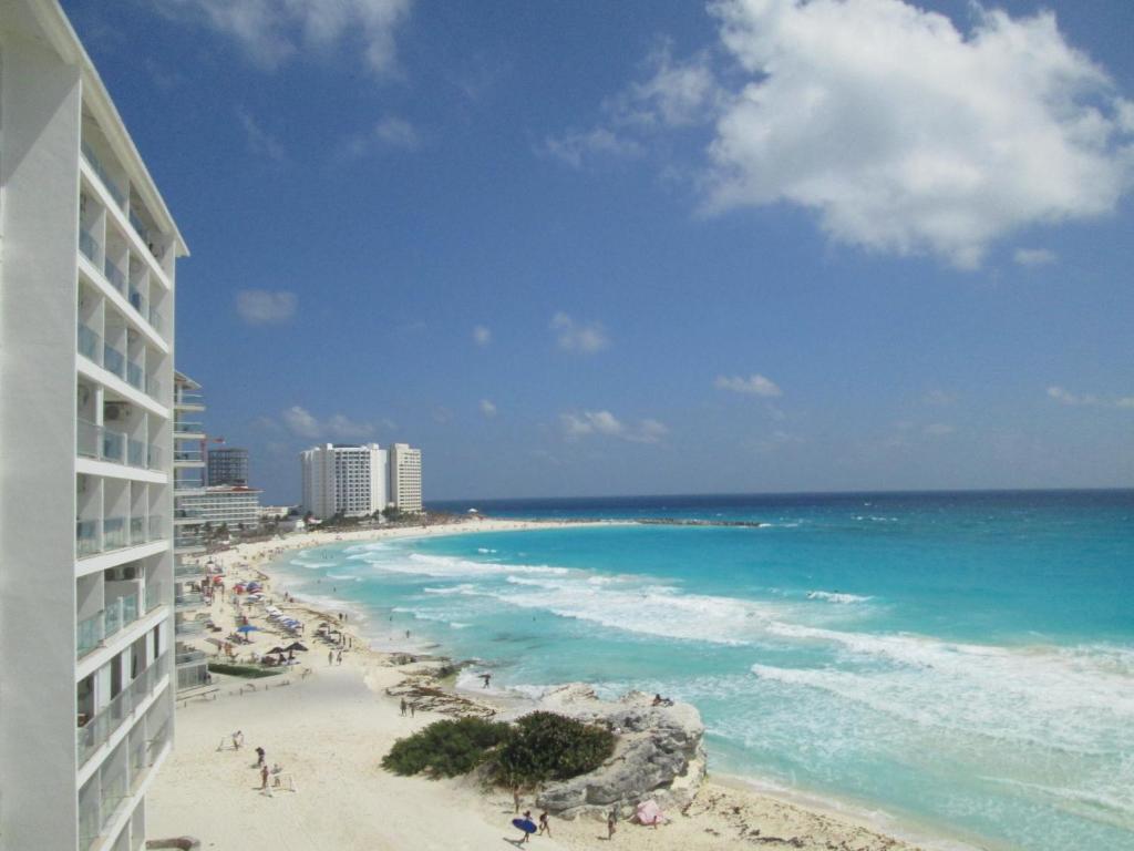 a view of the beach from a building at Apartment Cancun in Cancún