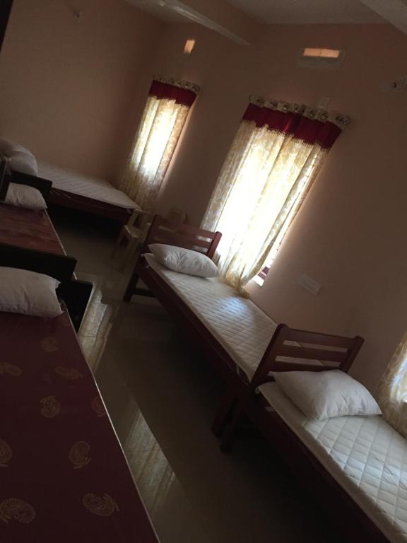 Postel nebo postele na pokoji v ubytování Mega Tourist Home