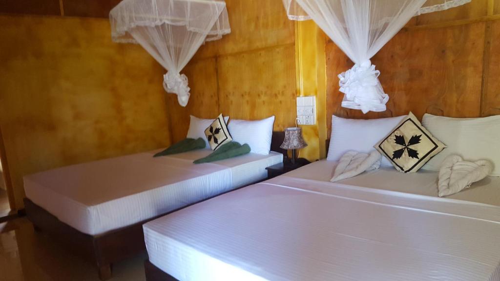 Postel nebo postele na pokoji v ubytování Sigiriya River Side Resort