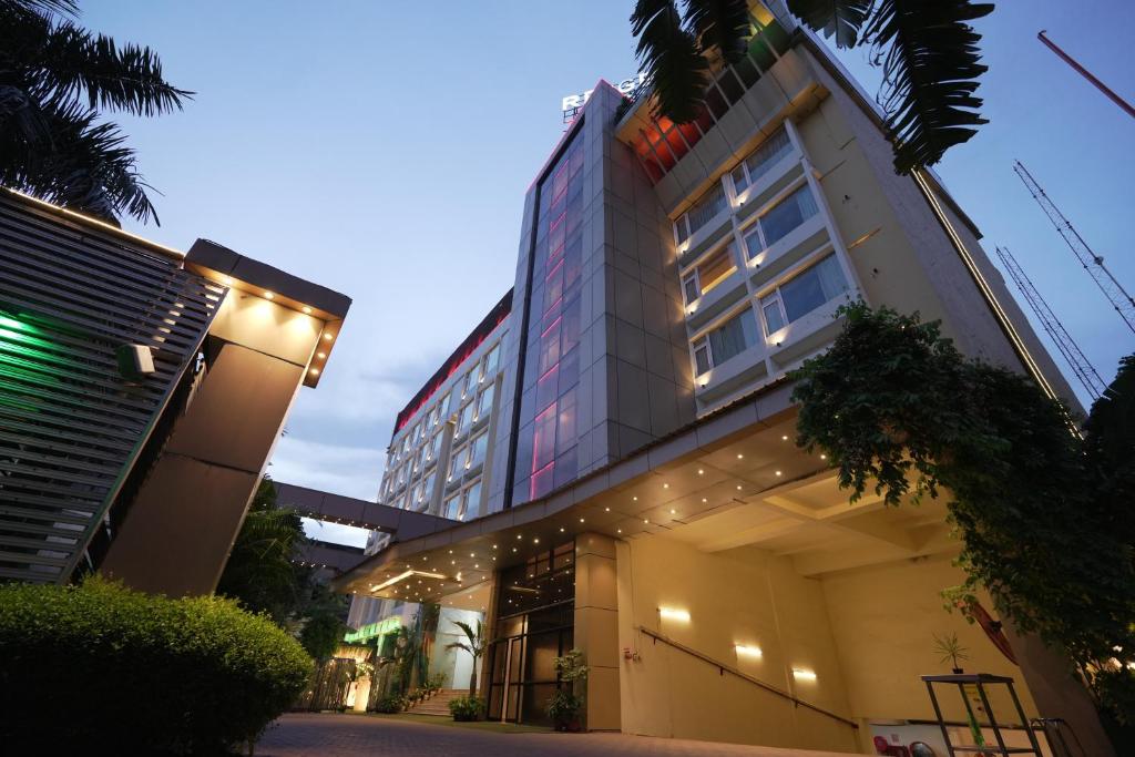 a building with lights on the side of it at Regenta Orkos Kolkata by Royal Orchid Hotels Limited in Kolkata