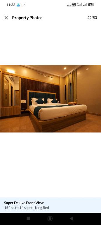 a bedroom with a large bed in a room at Hotel venus inn sajjangarh in Udaipur