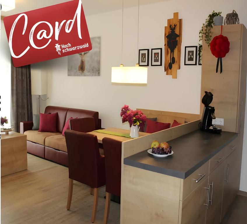 a living room with a cocacola sign on the wall at Ferienwohnung Schwarzwaldnest in Feldberg