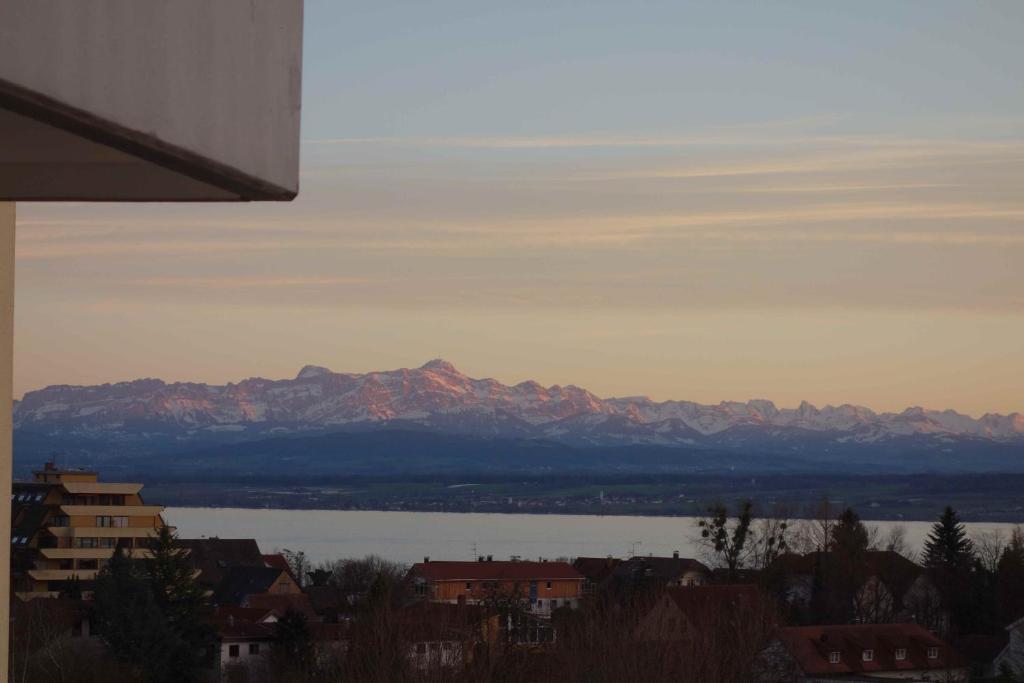 a view of a large body of water and mountains at Ferienwohnung Alex in Meersburg