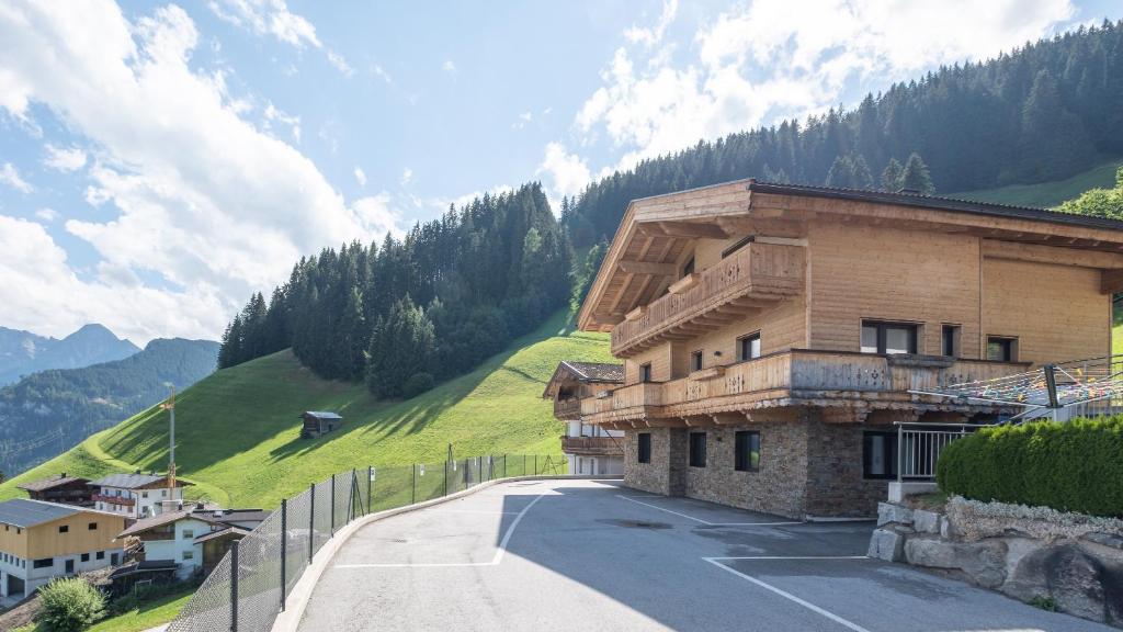 a building on the side of a mountain at Chalet Ahornblick in Mühlen