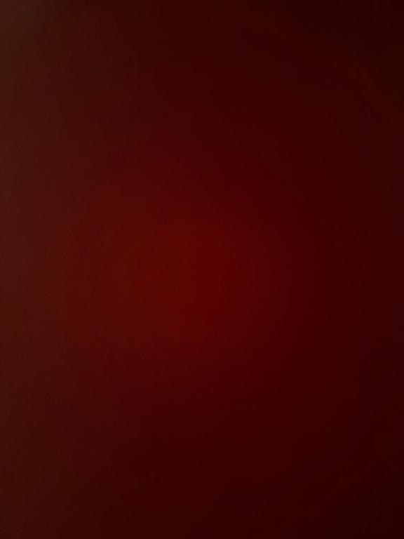 a dark red background with a plane in the sky at Villa jad in Essaouira