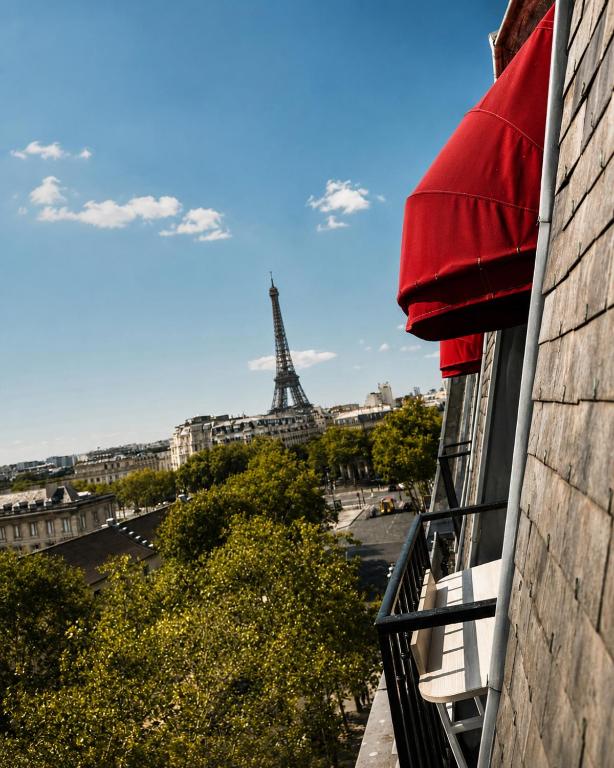 a view of the eiffel tower from a balcony at Hôtel Derby Eiffel in Paris