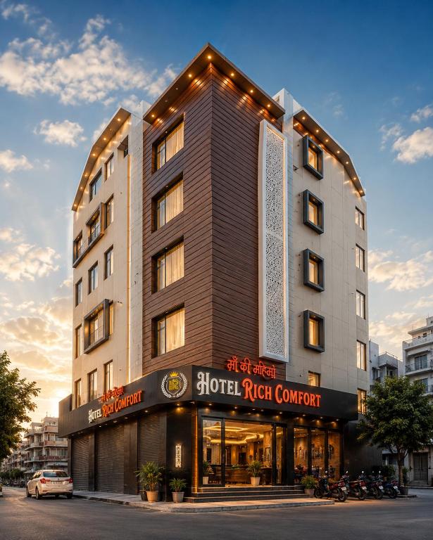 a building with a sign on the front of it at Hotel Rich Comfort Ajmer in Ajmer