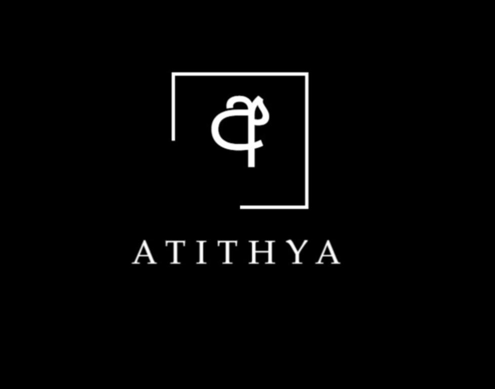 a logo for an apartment building with a door at Atithya Retreat in Hikkaduwa