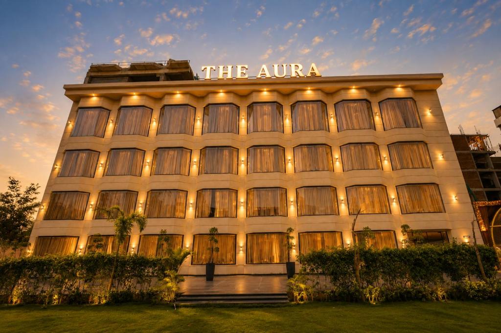 a large building with a sign on top of it at The Aura Hotel & Resort in Noida