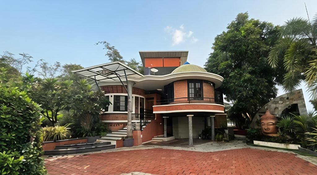 a house with a brick driveway in front of it at Vayal Heritage Villa in Angamaly