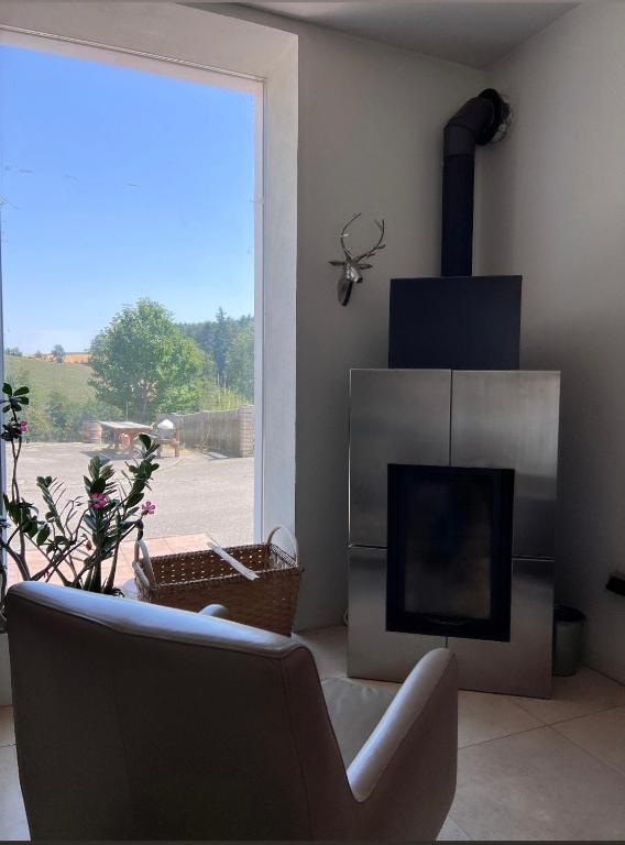 a living room with a couch and a television at Landidyll am Bauerhof in Sankt Valentin