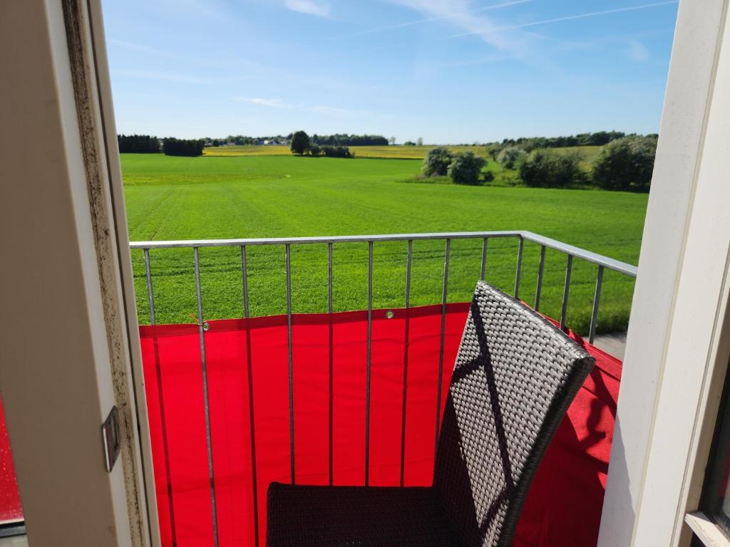 a balcony with a view of a soccer field at Roskilde B&B in Gadstrup