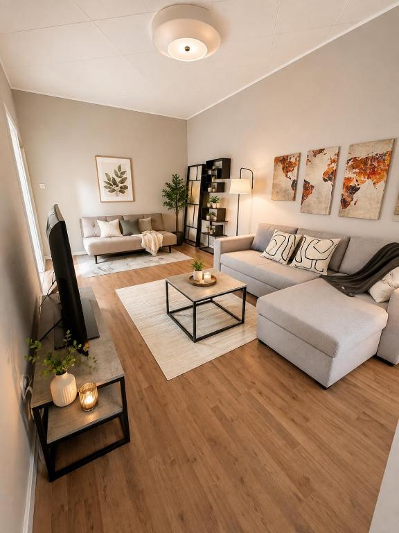 a living room with a couch and a table at City Point in Jyväskylä