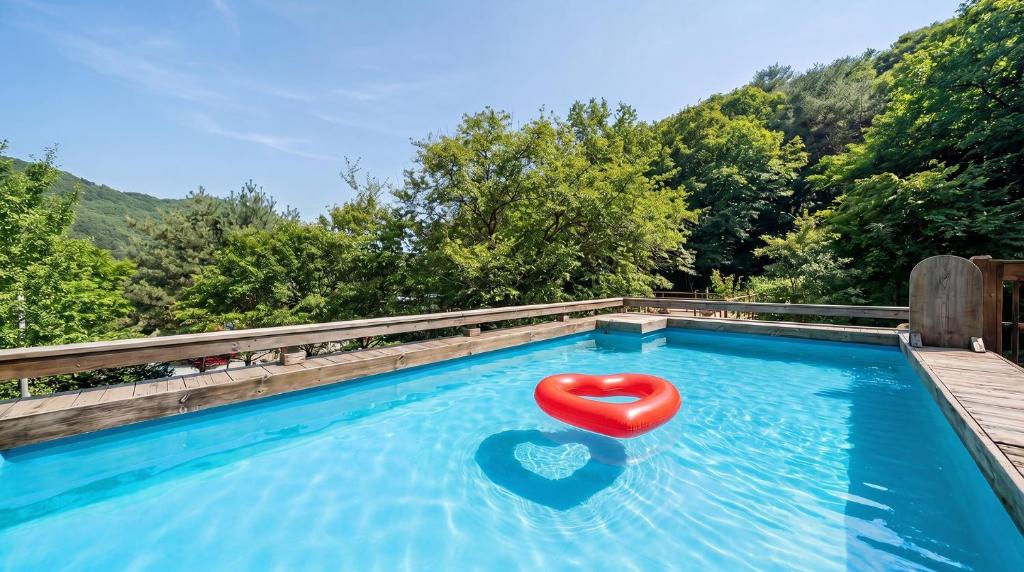 a red chair sitting in a swimming pool at Gapyeong Ruba Pension in Gapyeong