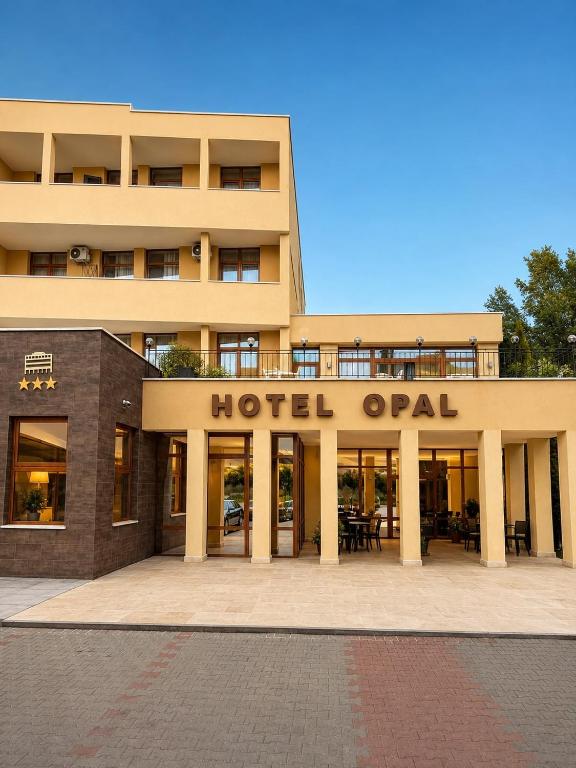 a hotel opal building with the hotel open at HOTEL OPAL Zalau in Zalău