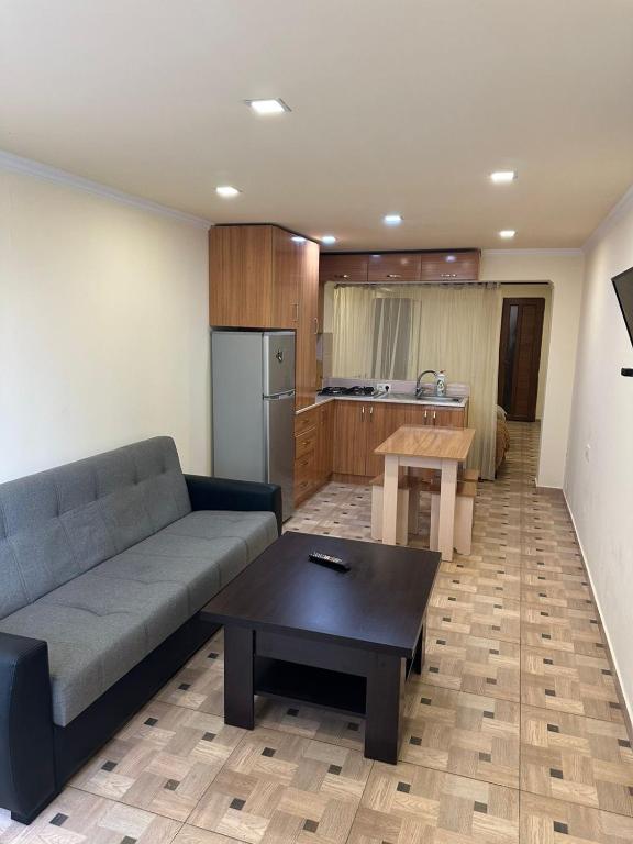 a living room with a couch and a table at Villa hills II in Yerevan