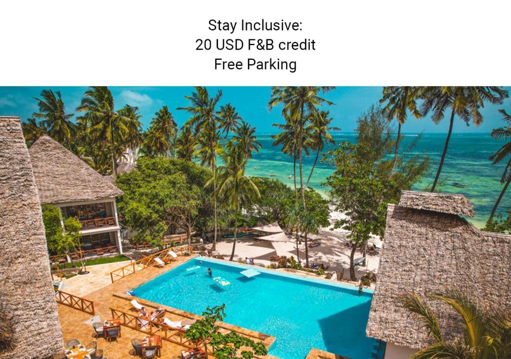 an image of a resort with a swimming pool and the ocean at Zanzibella Hotel & SPA in Kiwengwa