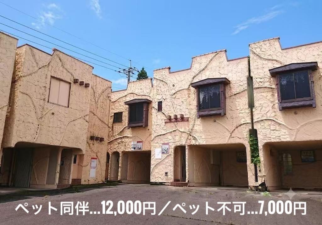 an old building with writing on the side of it at ホテルＪoＪo in Ikaho