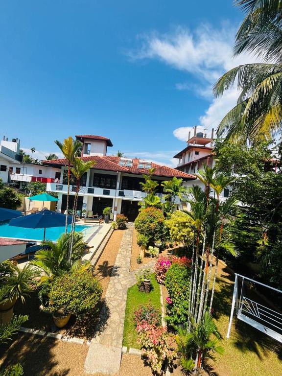 an aerial view of a resort with trees and plants at Sky and Sand Guesthouse in Beruwala
