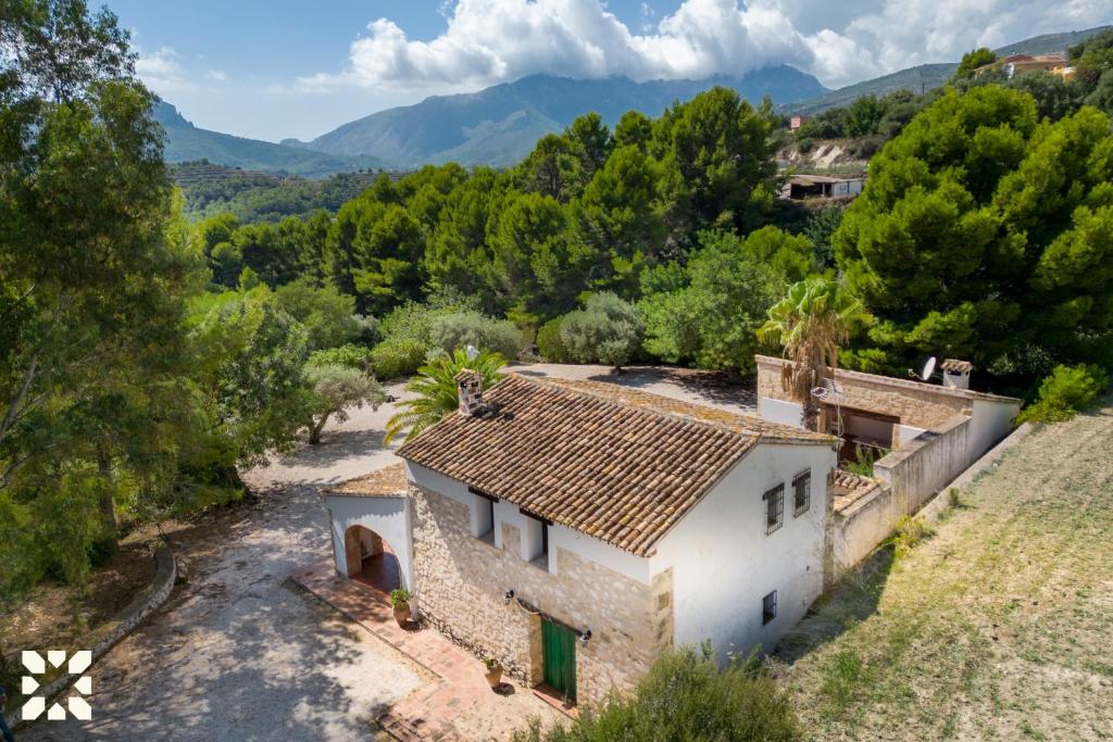 an aerial view of a house with mountains in the background at Villa Fantaxat by Abahana Villas in Benissa