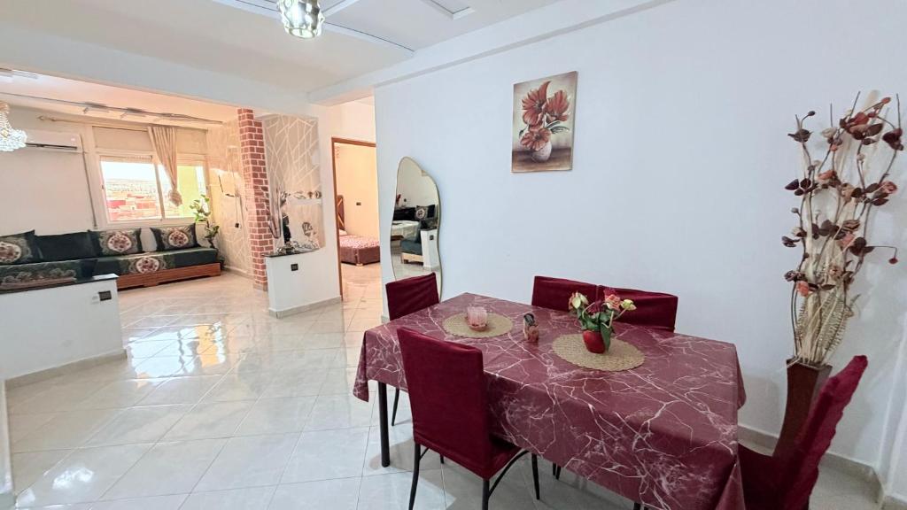 a dining room with a table and chairs at marhaba apartement in Oujda