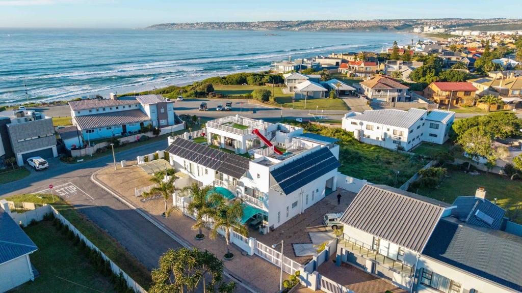 an aerial view of a small town next to the ocean at Withuis Hartenbos - No Load Shedding in Hartenbos