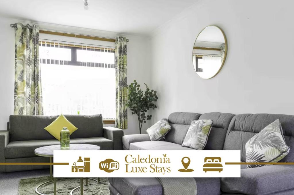 a living room with a couch and a table at Redding House in Falkirk
