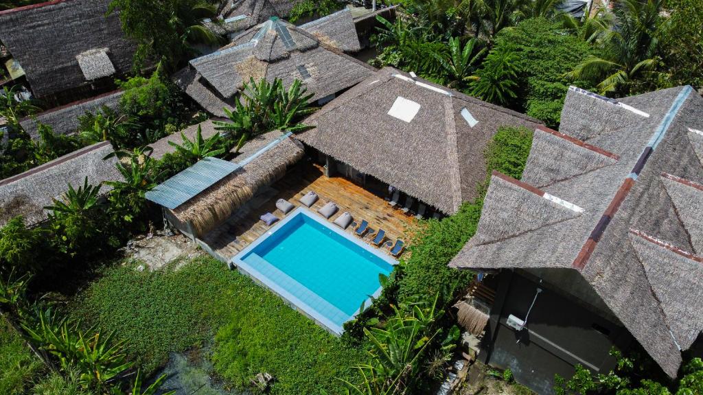 an overhead view of a house with a swimming pool at The Ohm Siargao Resort in General Luna