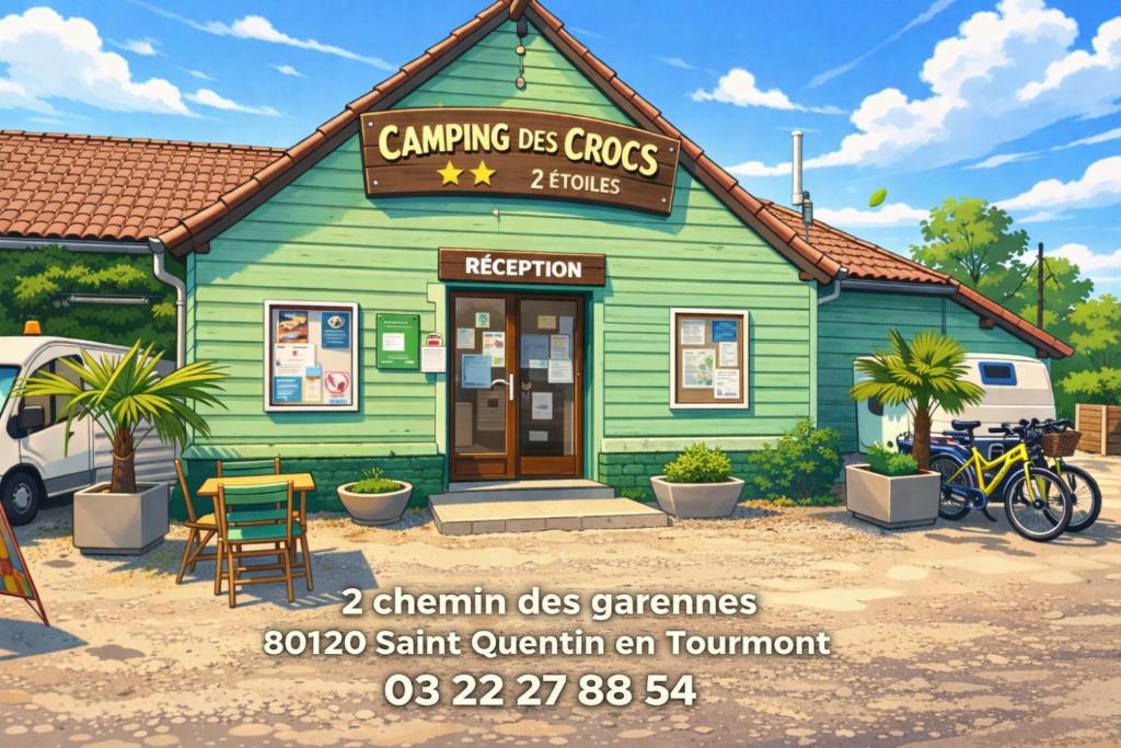 a small green building with a sign on it at camping des crocs in Saint-Quentin-en-Tourmont