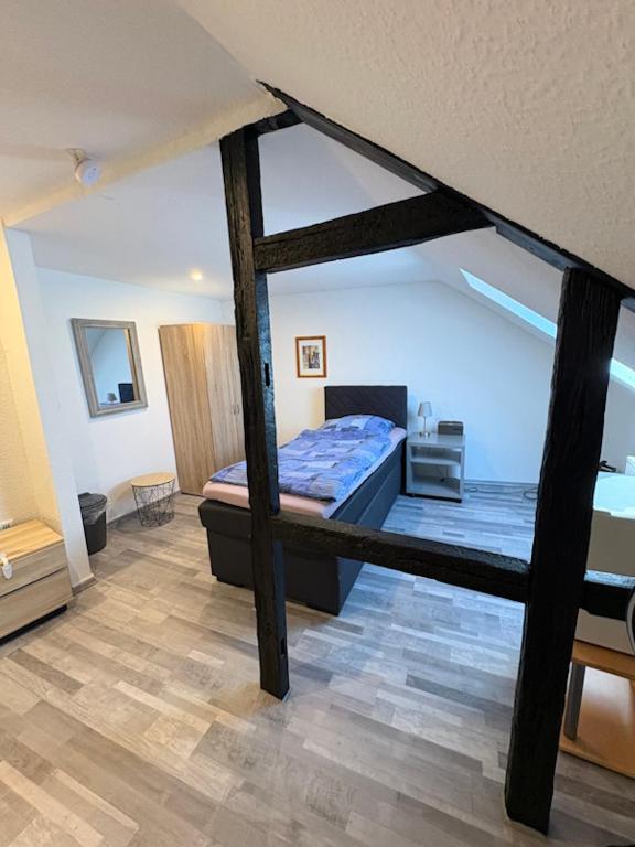 a bedroom with a large bed in a room at Gästehaus-City in Helmstedt