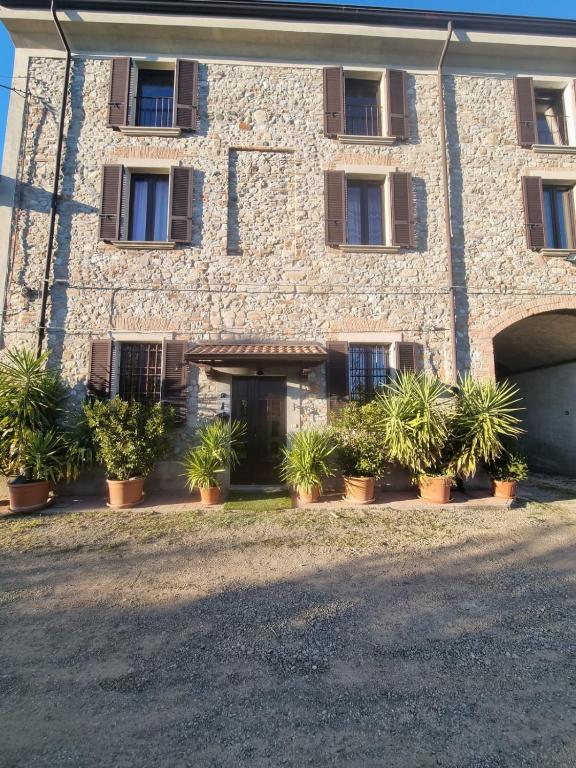 a building with potted plants in front of it at b&b MADDIALE 