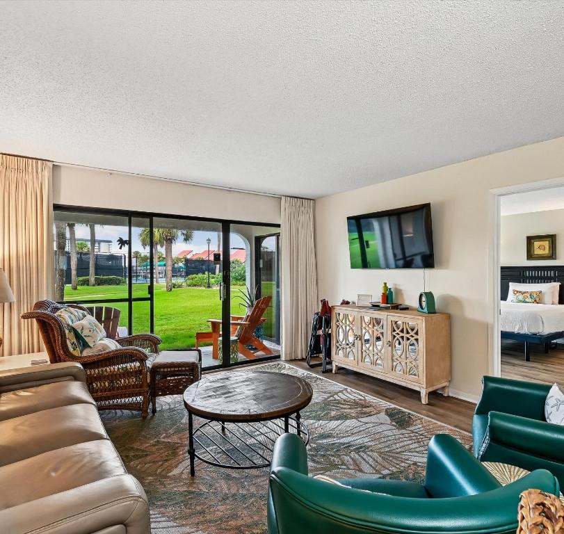 a living room with a couch and a table at Edgewater Villa #2604 in Panama City Beach