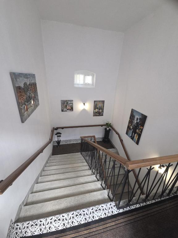a staircase in a building with a stair case at Happyzem in Sátoraljaújhely