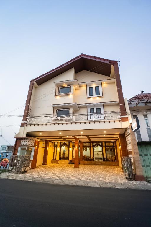 a building on the corner of a street at Bintang Samudra Hotel in Jepara