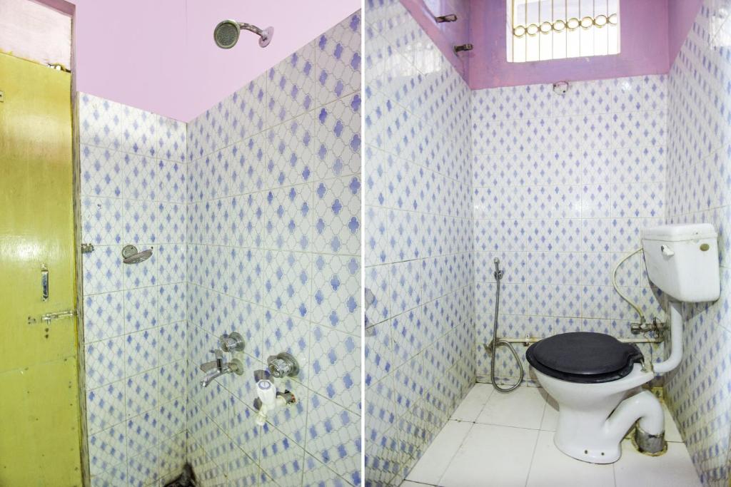 a bathroom with a toilet and a shower at Hotel O Suvidha in Jamshedpur