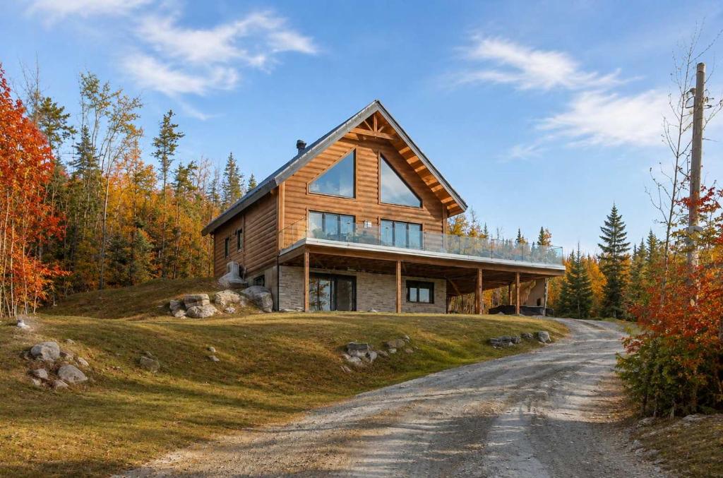 a house on top of a hill with a dirt road at Spa Pool Table Ultimate Comfort - OSE Le Refuge in Saint Come