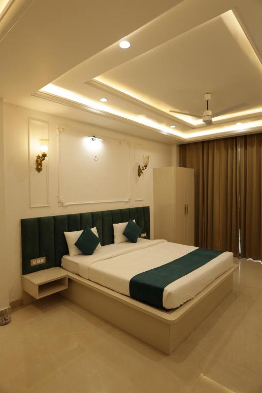 a bedroom with a large bed in a room at The Woods by CASA D' GAVA in Lucknow