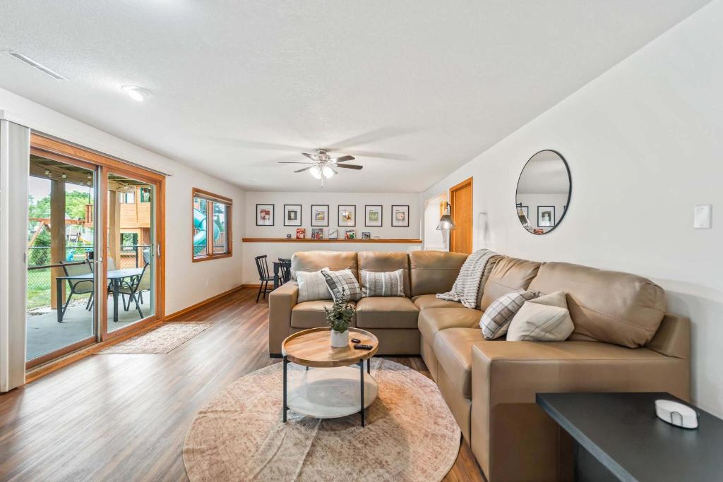 a living room with a couch and a table at Des Moines 4BR Family Getaway in Des Moines