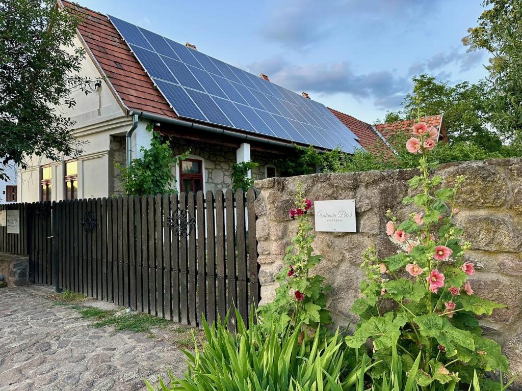 a house with solar panels on the roof at Vitamin B63 Vendégház in Boldogkőváralja