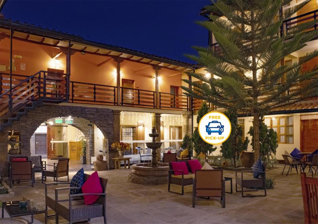 a hotel with a patio at night at Union Hotel Cusco in Cusco