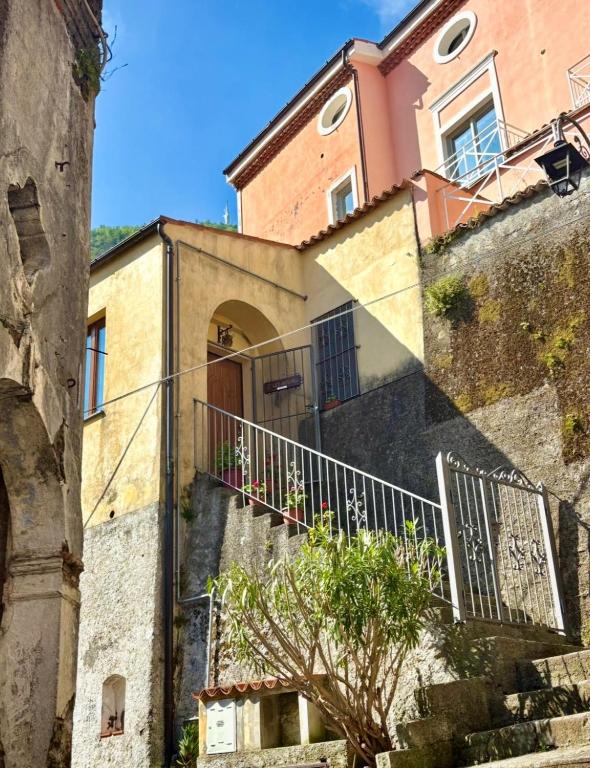 a building with a staircase leading up to a building at L'Oleandro in Maratea