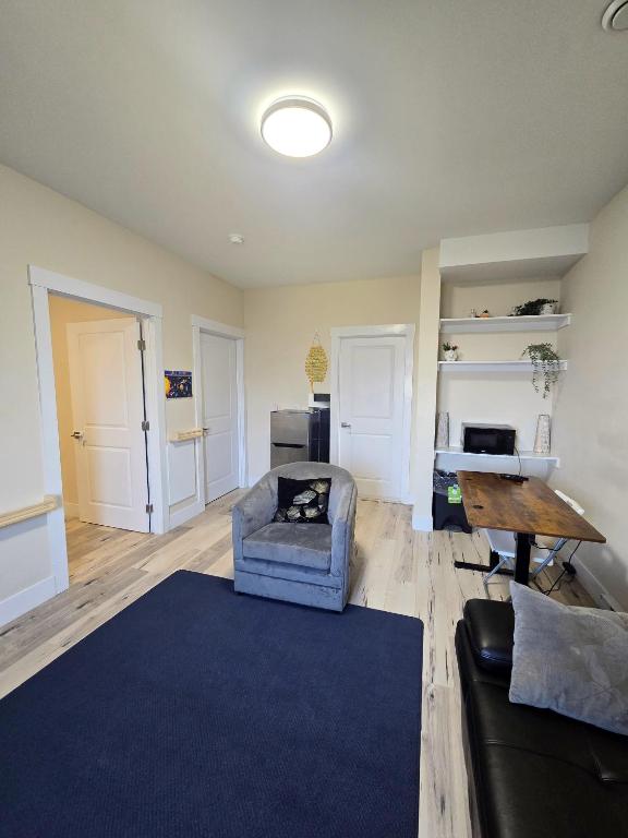 a living room with a couch and a table at 1 bedroom apartment in Halifax