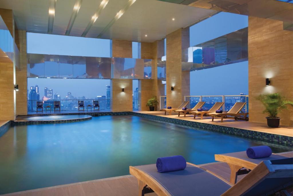 
a large swimming pool in a hotel room at Citadines Rasuna Jakarta in Jakarta
