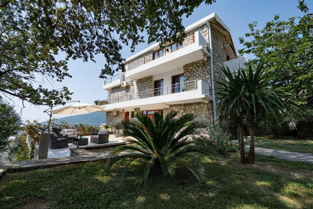 a villa with a view of the ocean at Casa Mare & Monti in Budva