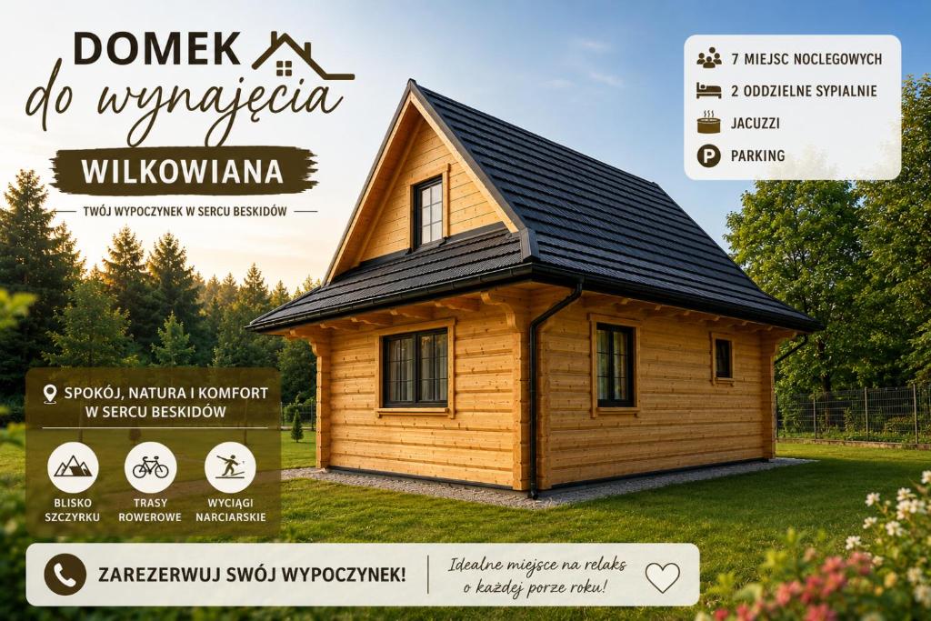 a small wooden house with a black roof at Wilkowiana in Wilkowice