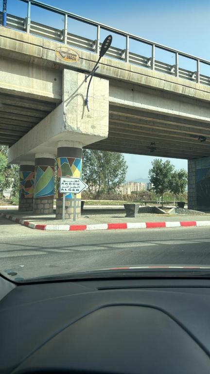 a view from a car of a bridge over a road at Rèsidance Mimosa in Bejaïa