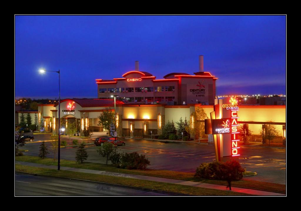 a large building with a gas station in a parking lot at Century Casino & Hotel Edmonton in Edmonton