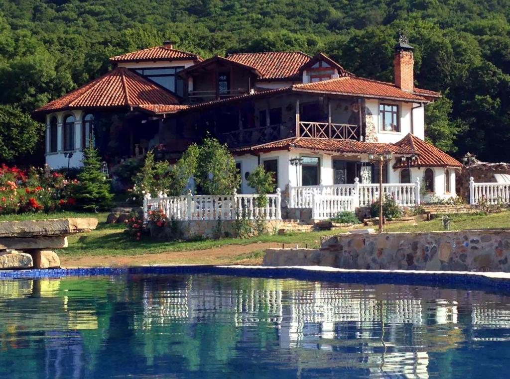 a house on the shore of a body of water at Georgios Ranch in Tsodoreti
