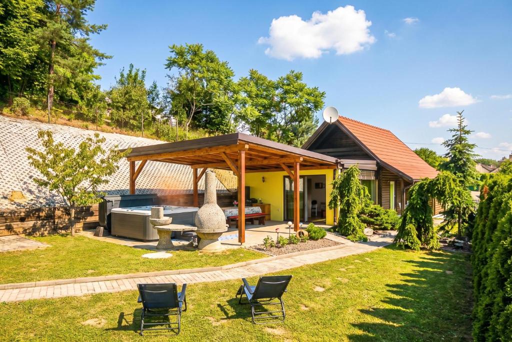 a backyard with a gazebo and chairs at Ladybug House Nature Retreat w/ Jacuzzi - Happy Rentals in Fokovci